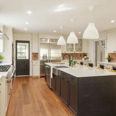 Kitchen Spanning Island Offers Room for Food Prep and Sampling