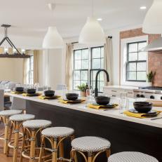 Black-and-White Open-Concept Kitchen Flows Into Attractive Dining