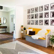 Entry Features Gallery Wall With Bright Yellow Bench