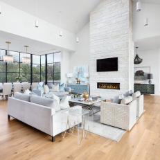 White Open Concept Living Area With Angled Ceiling