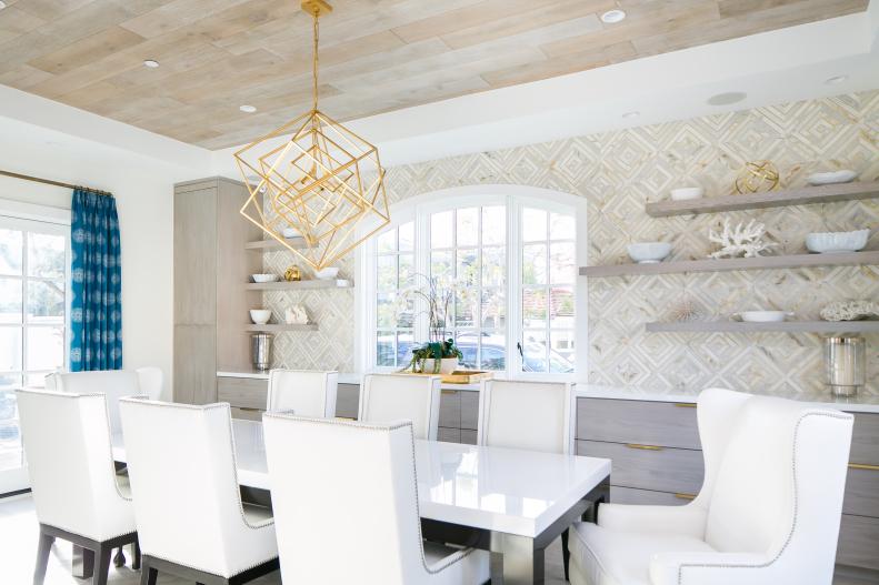 Dining Room Features a Wallpaper Accent Wall and a Built-In Buffet