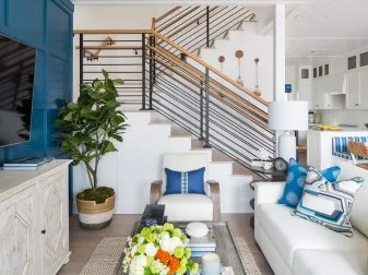 Bold Color Wall With TV in Small Living Room, Wood Rail Stairs In View