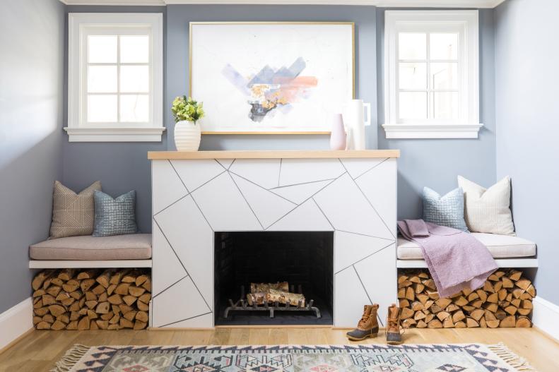 Bright Sitting Area Features a Stone Fireplace and Built-in Benches