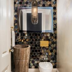 A Powder Room Features Octagon Tile and a Marble Pedestal Sink