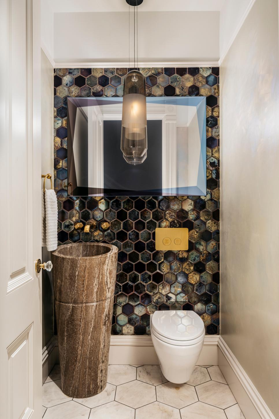 A Powder Room Features Octagon Tile and a Marble Pedestal Sink | HGTV