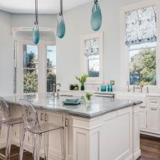 Bright Kitchen Features Traditional Cabinets and a Large Island