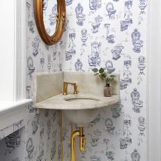 Traditional Blue-and-White Powder Room With Whimsical Wallpaper