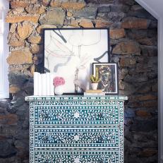 Beautiful Bone-Inlay Chest in Front of Stone Accent Wall in Studio