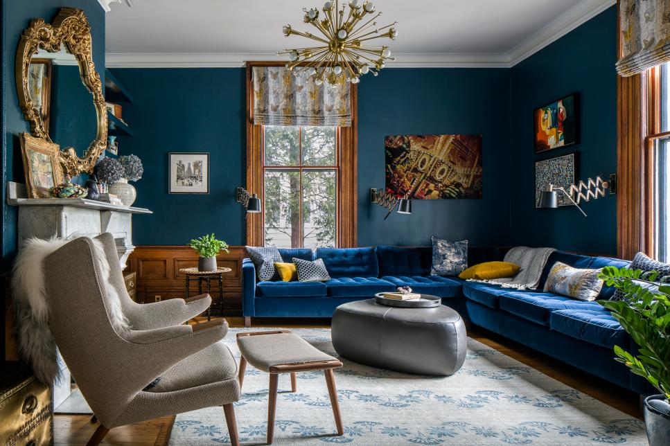 Moody Living Room Features a Velvet Sectional and Eclectic Accents