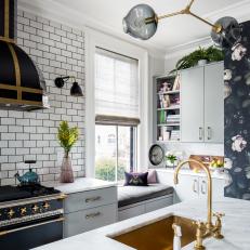 Bright Kitchen Features a Subway Tile Backsplash, a Midcentury Modern Light Fixture and Brass Fixtures