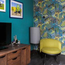 Eclectic Room Features Vibrant Blue Walls, a Wallpaper Accent Wall and Modern Furniture