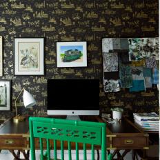 Eclectic Home Office Features a Black and Gold Wallpaper Accent Wall and an Antique Desk 