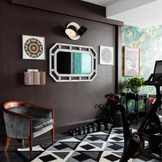 Modern Home Gym Features a Gallery Wall and a Patterned, Multicolored Rug