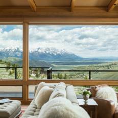 Rustic Living Room With Snowy Mountain View