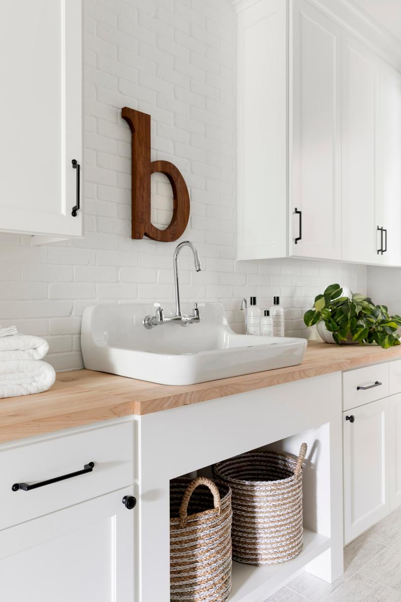 Modern, White Laundry Room With Vessel Sink, Wooden Counters, Art