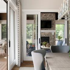 Transitional Dining Room With Covered Porch Access