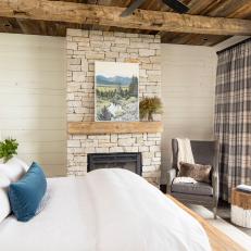 Shiplapped Bedroom Features Hand-Hewn Exposed Beams 