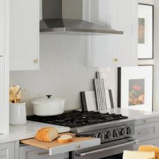 Stainless Range and Gray-and-White Cabinetry in Beautiful, Sunlit Kitchen