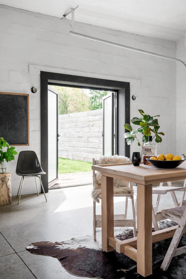 In addition to having multiple garage doors on the property, there's a set of French doors connecting the dining area to a lush outdoor space just off Steve's entry. In the warmer months, this makes the warehouse style home ideal for entertaining friends and family.