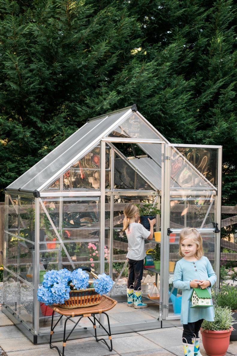 To teach daughters Grace and River the basics of gardening, parents Robert and Tiffany Peterson invested in an affordable, lightweight and easy-to-assemble greenhouse located just steps from their kitchen. Whether they're collecting worms for the gardening beds or keeping potted flowers watered, the entire family enjoys playing in the dirt.