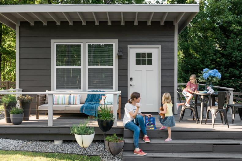 Tiffany Peterson and daughters Grace and River play on the deck of their indoor-outdoor photography studio, a shed structure designed for planning and producing upcoming shoots and retouching images. While husband Robert works inside, Tiffany keeps the kids active outside.