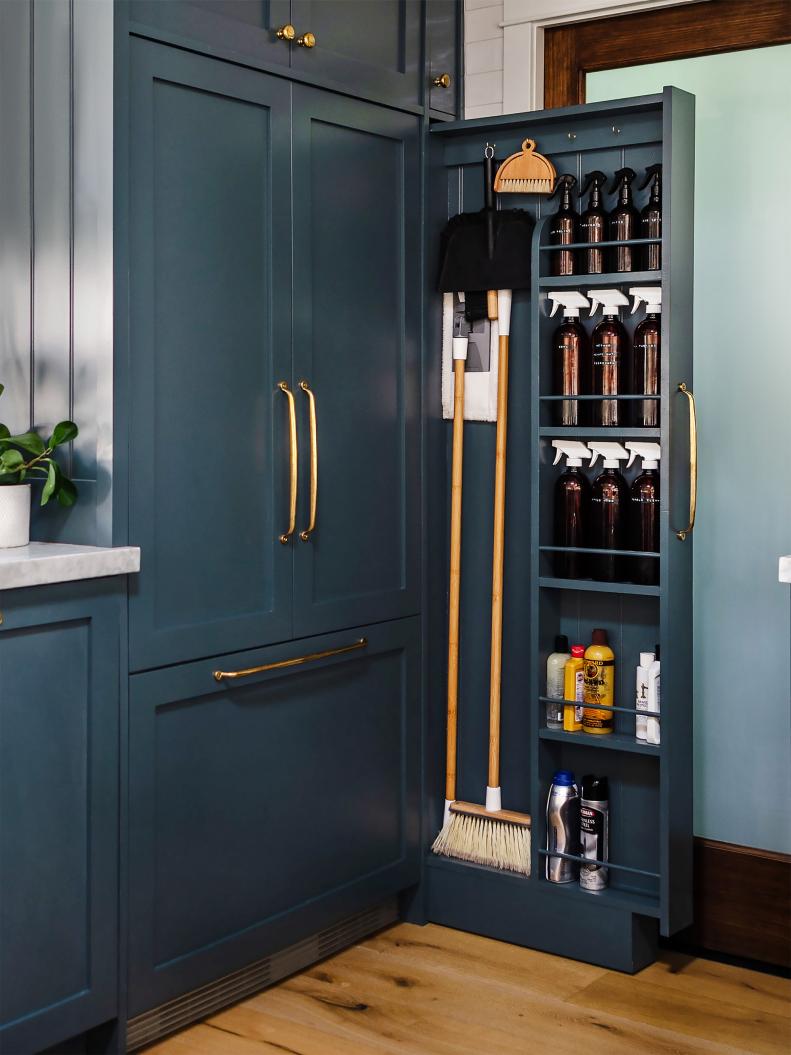 Blogger Jessica D’Itri Marés and her husband, Tyler, of Renovate 108, installed the pullout cabinet themselves and painted it Narragansett Green by Benjamin Moore. “Now I can see all my cleaning products at a glance instead of digging through rows of bottles in a cabinet,” says Jessica. They prefer to get large refill jugs of cleaners and pour them into amber glass bottles from Amazon that they label for — what else? — a clean look.