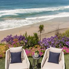 White Outdoor Armchairs and Beach