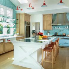 Blue Country Kitchen With Red Sconces
