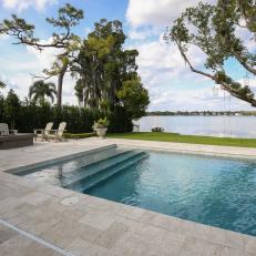 Firepit and Treehouse Accompany Lakeside Pool