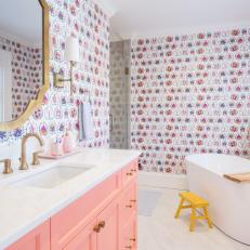 Pink Child's Bathroom With Freestanding Tub