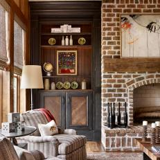 Family Room With Brick Fireplace and High Ceilings