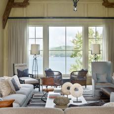 Living Room With High Ceiling and Lake Views