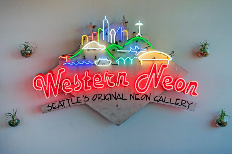 Seattle Skyline in Neon Sign That Spells Out Western Neon