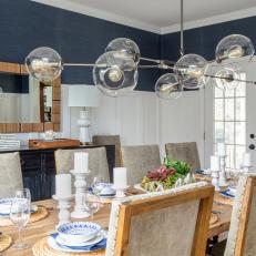 Blue Coastal Dining Room With Glass Chandelier
