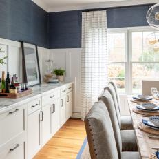 Blue Coastal Dining Room With White Cabinets