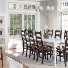 White Transitional Dining Area With Black Chairs