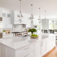 White Chef Kitchen With Black Dining Chairs