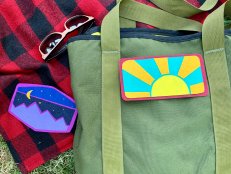 Sunshine Felt Patch on Green Bag, Purple Patch on Red & Black Blanket 