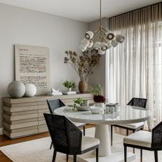 Neutral Contemporary Dining Room With Black Chairs