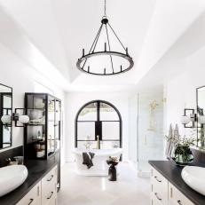 Black and White Spa Bathroom With Arched Door