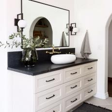 Black and White Bathroom Vanity With Gray Vase