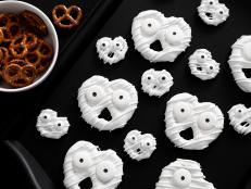 Fun and friendly ghost pretzels are salty-sweet, poppable party treats! Arrange them on a tray or add them to a big bowl of party snack mix. The large and small candy eyeballs can be found at most craft stores or ordered online.