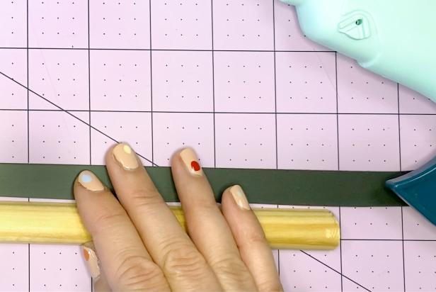 Measure the magnet strips to match the length of the pine trim piece.