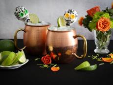 The traditional Moscow Mule gets a spicy twist using tequila and a pinch of ancho chile powder. Plain mini sugar skulls can be purchased online, then decorated at home with our instructions.