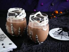 This cocktail is a real scream to drink! The chocolate cocktail is sipped through marshmallow webbing stretched over the glass. Candy spider sprinkles complete the look!