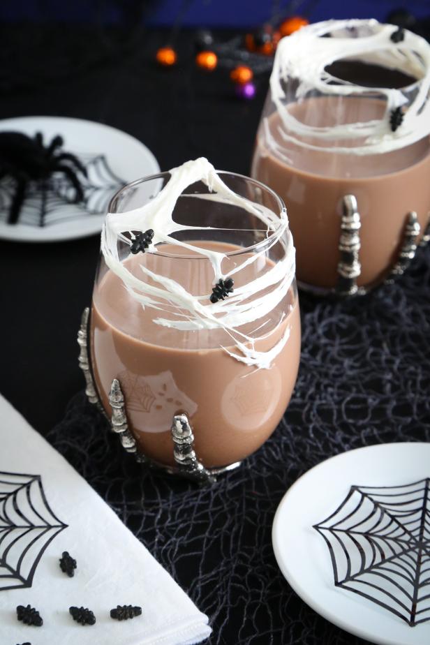 This cocktail is a real scream to drink! The chocolate cocktail is sipped through marshmallow webbing stretched over the glass. Candy spider sprinkles complete the look!