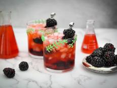 Alter the classic bourbon smash with muddled fresh blackberries to create a different kind of cocktail creature.  For special effect, pipe monster stitches onto each glass using melted candy. 