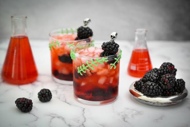 Alter the classic bourbon smash with muddled fresh blackberries to create a different kind of cocktail creature.  For special effect, pipe monster stitches onto each glass using melted candy. 