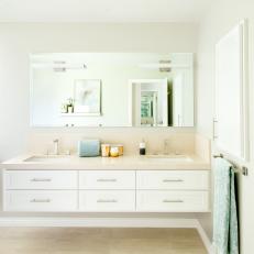 Neutral Bathroom With White Floating Vanity