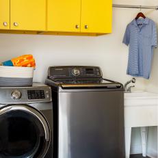 Modern Laundry Room With Yellow Cabinets